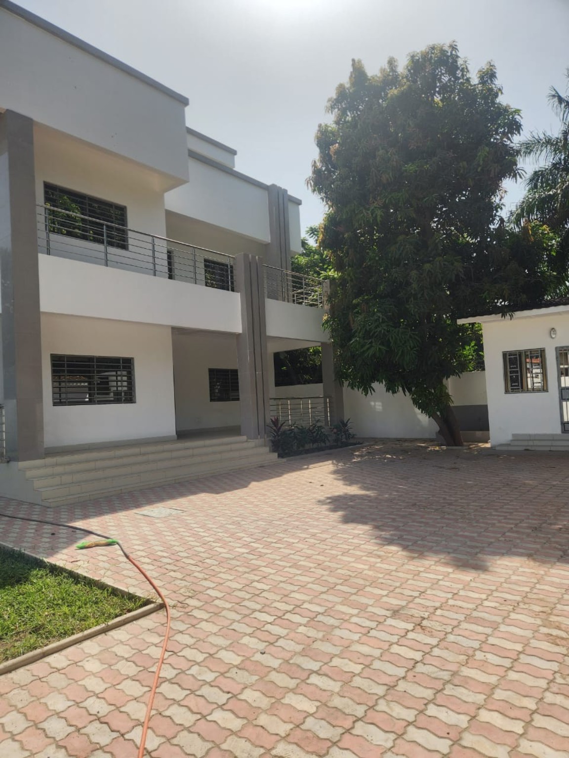 Completed two-storey family home with paved courtyard
