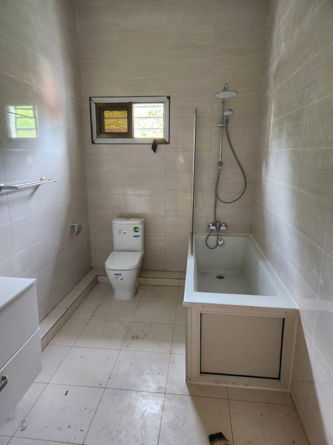 Finished bathroom with bath, shower and vanity unit
