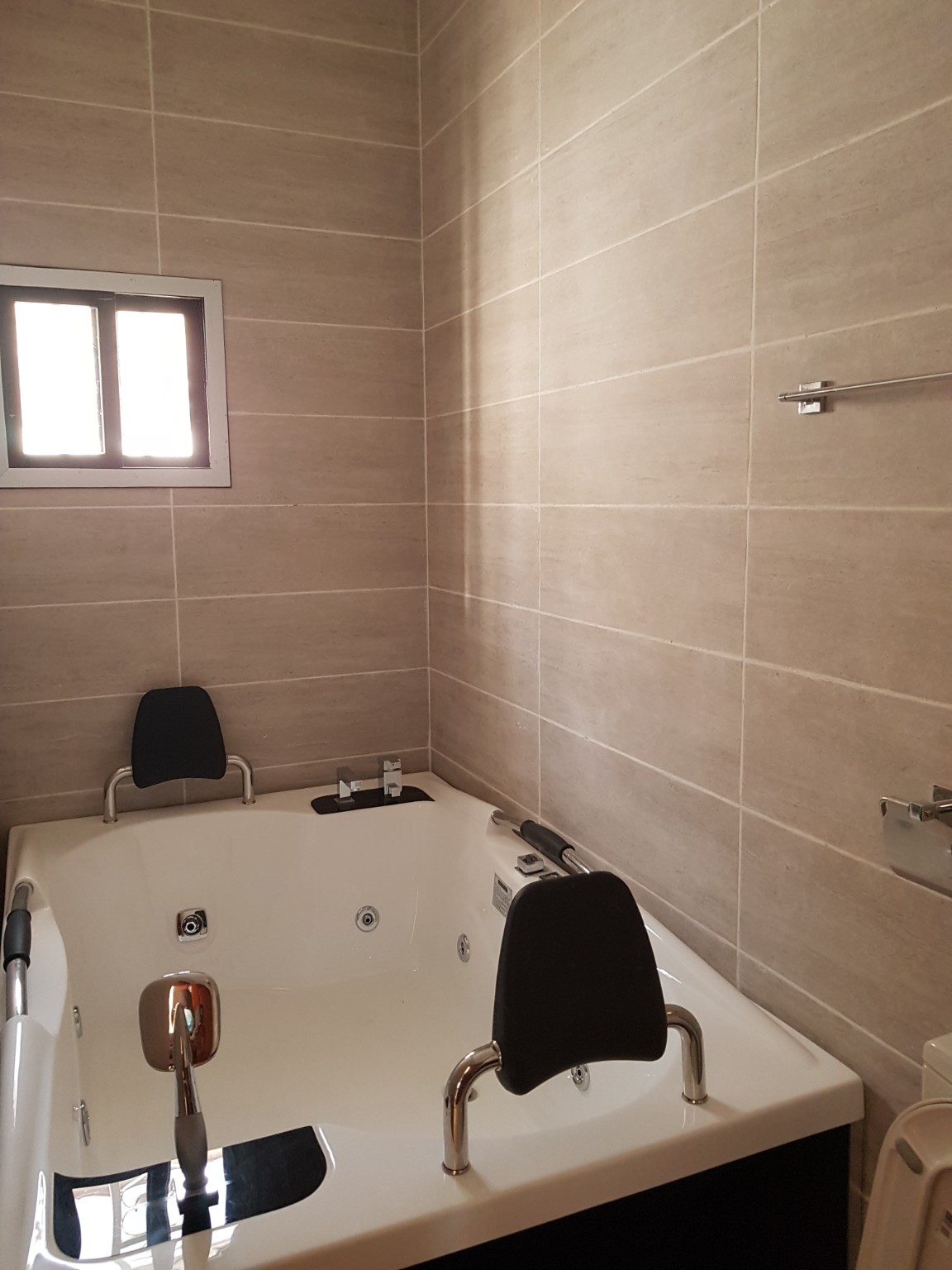 Additional bathroom view with jacuzzi feature
