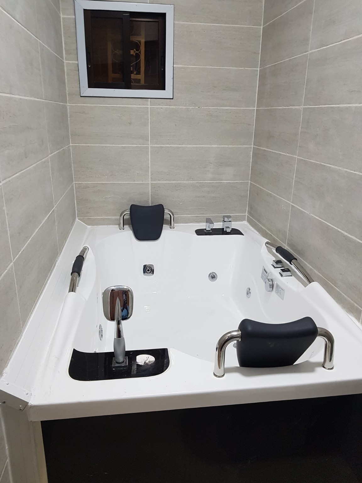 Finished bathroom with jacuzzi bath